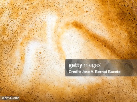 Full frame of a cup of freshly made coffee with milk, backgrounds. Full frame of a cup of freshly made coffee with milk, backgrounds.