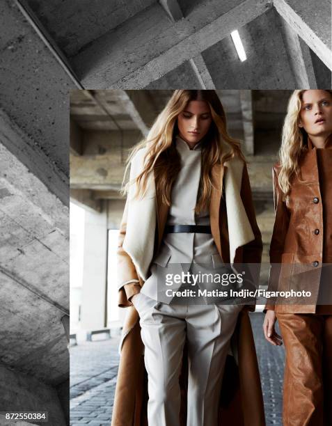 Models Estee Rammant and Nathalia O pose at a fashion shoot for Madame Figaro on September 19, 2017 in Paris, France. Left: Coat , trench , suit and...