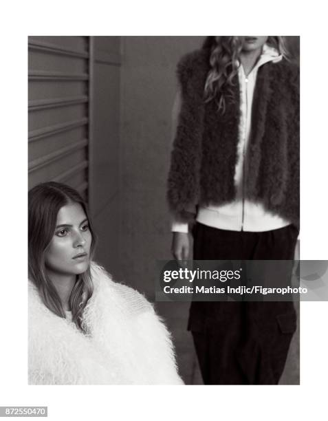 Models Estee Rammant and Nathalia O pose at a fashion shoot for Madame Figaro on September 19, 2017 in Paris, France. Left: Coat . Right: Vest ,...