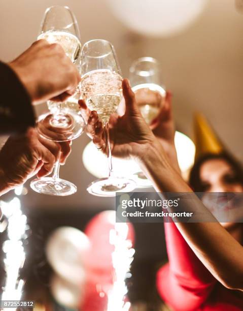 friends toasting champagne for the new year - new years 2018 stock pictures, royalty-free photos & images
