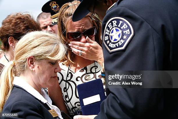 Susan Moody , wife of Richmond, California, police officer Bradley Moody who was killed in a car accident while responding to a call that involved a...