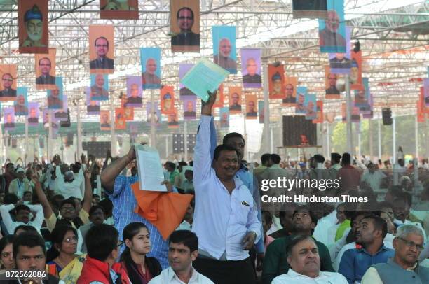 Madhya Pradesh Chief Minister Shivraj Singh Chouhan offering turban to President Ram Nath Kovind during Kabir Mahotsav on November 10, 2017 in...