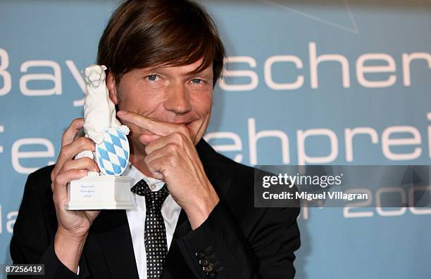 Director Roland Suso Richter poses with her award during the Bavarian Television Award 'Blauer Panther' 2009 at the Prinzregententheater on May 15,...