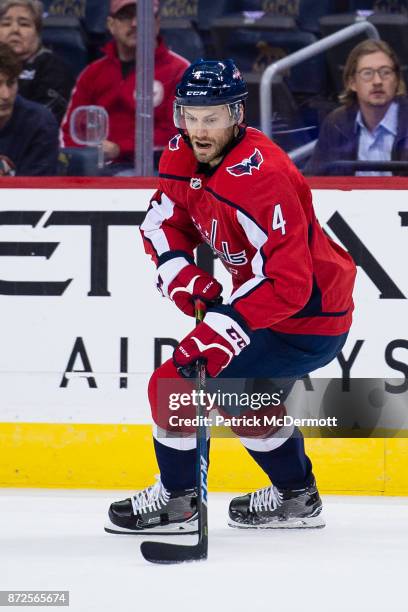 Taylor Chorney of the Washington Capitals skates with the puck in the first period against the New York Islanders at Capital One Arena on November 2,...