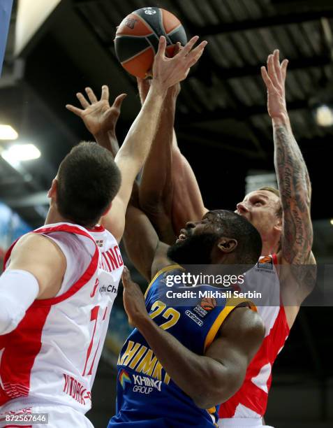 Charles Jenkins, #22 of Khimki Moscow Region competes with Janis Timma, #6 and Matt Janning, #11 of Baskonia Vitoria Gasteiz in action during the...