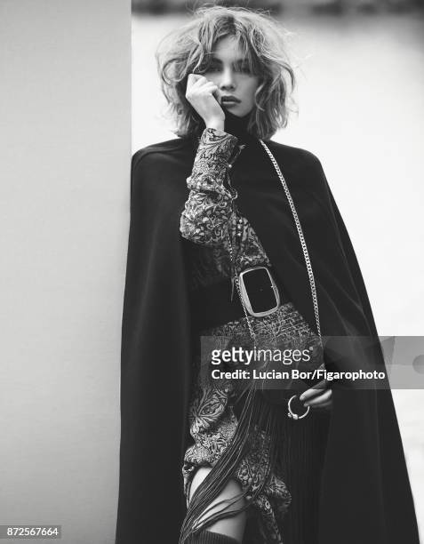 Model Klaudia K poses at a fashion shoot for Madame Figaro on September 12, 2017 in Paris, France. Cape , dress , sweater , belt , bag . PUBLISHED...