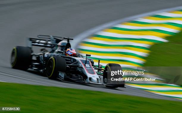 Haas F1's French driver Romain Grosjean powers his car during the Brazilian Formula One Grand Prix practice session, at the Interlagos circuit in Sao...