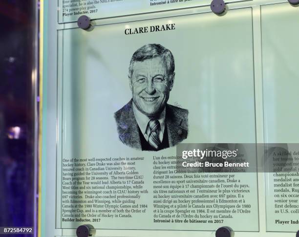 The Hall of Fame plaque for Clare Drake is installed in the Great Hall at the Hockey Hall Of Fame and Museum prior to a press conference on November...