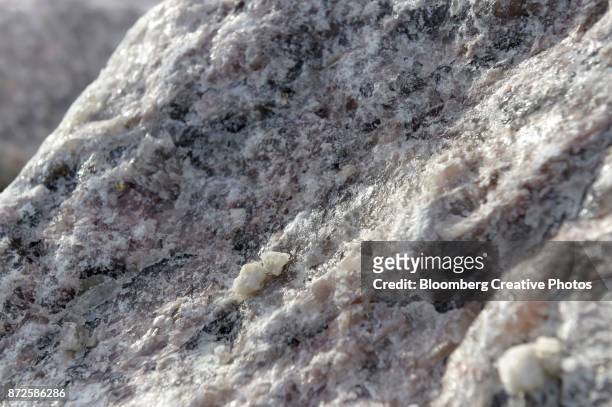 a piece of lithium ore sits on a pile - oceana stock pictures, royalty-free photos & images