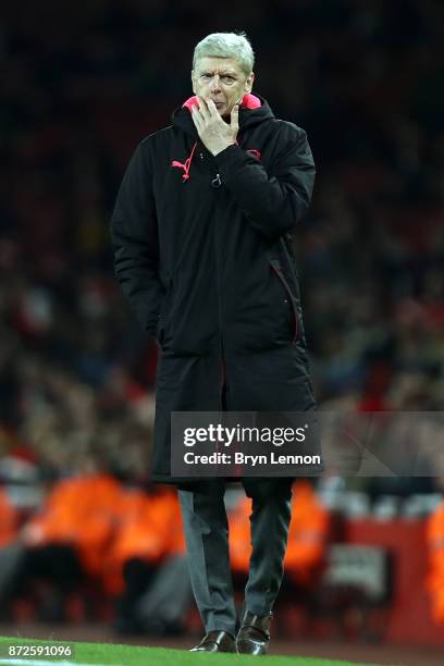 Arsenal Manager Arsene Wenger looks on during the UEFA Europa League group H match between Arsenal FC and Crvena Zvezda at Emirates Stadium on...