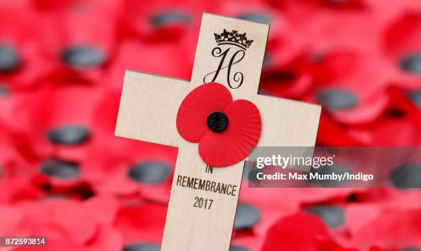 Prince Harry's Remembrance Tribute Cross, bearing his Royal Cypher, which he planted during a visit to the Field of Remembrance at Westminster Abbey...