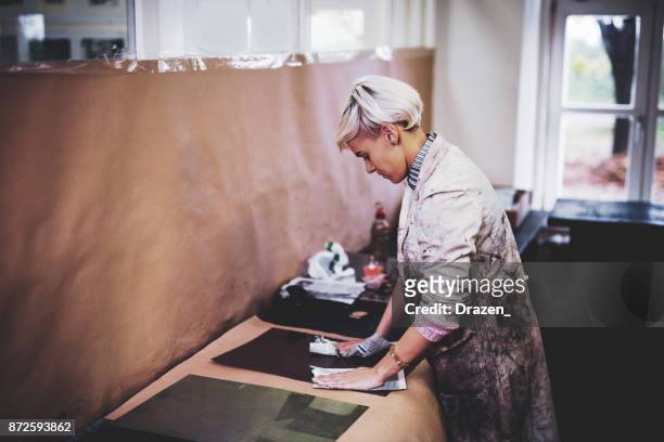 craftswoman working in workshop and creating new craft products - intaglio stock pictures, royalty-free photos & images