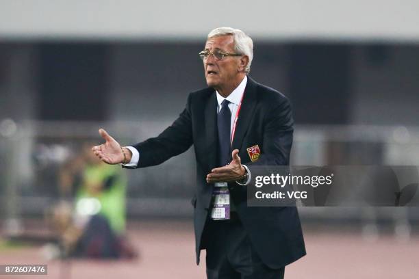 Marcello Lippi, head coach of China, looks on during International Friendly Football Match between China and Serbia at Tianhe Stadium on November 10,...