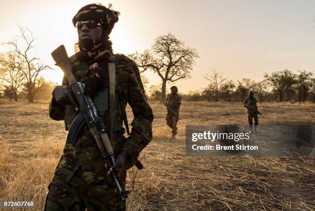 Zakouma Rangers "Mamba Team 1" seen inside the park during one of their anti-poaching patrols. Driver Issa Idriss Adoum, wearing the brown shirt,...