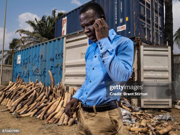 Lieutenant AWI Essossimna, Chef de l'Unité Mixte de Contrôle des Conteneurs, Port Autonome de Lomé, is seen with containers with 4 tons of illegal...