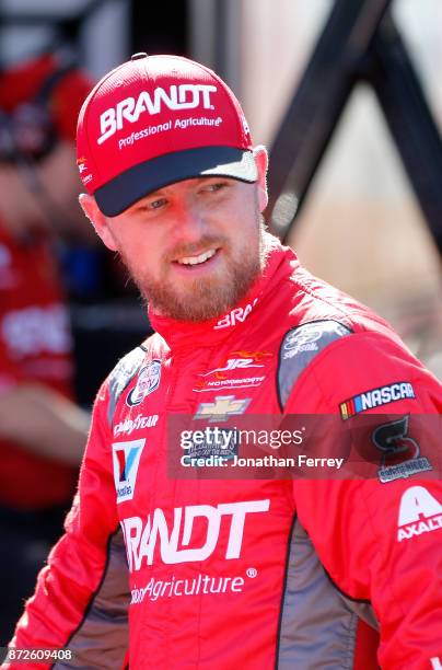 Justin Allgaier, driver of the BRANDT Professional Agriculture Chevrolet, gets into his car during practice for the NASCAR XFINITY series Ticket...