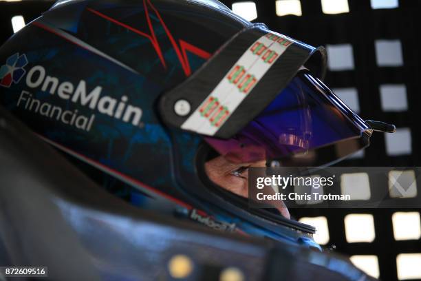 Elliott Sadler, driver of the Cessna Chevrolet, sits in his car during practice for the NASCAR XFINITY series Ticket Galaxy 200 at Phoenix...
