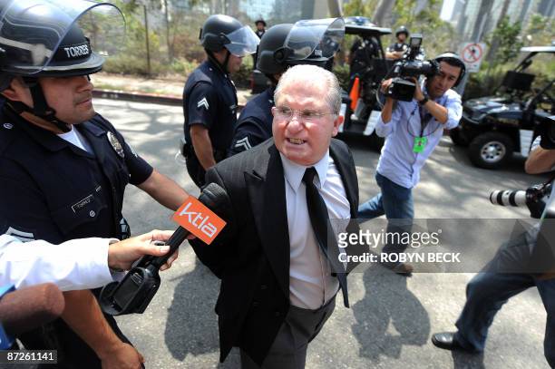 Los Angeles teachers' union president AJ Duffy is arrested during a protest against budget cuts which would increase class sizes outside the Los...