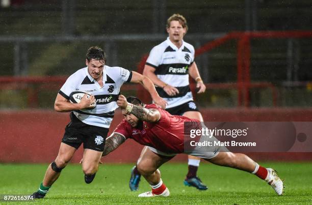 Limerick , Ireland - 10 November 2017; George Bridge of Barbarians RFC is tackled by Ben Tameifuna of Tonga during the Representative Match between...