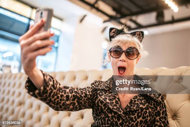 stylish and quirky senior woman at restaurant - insólito imagens e fotografias de stock