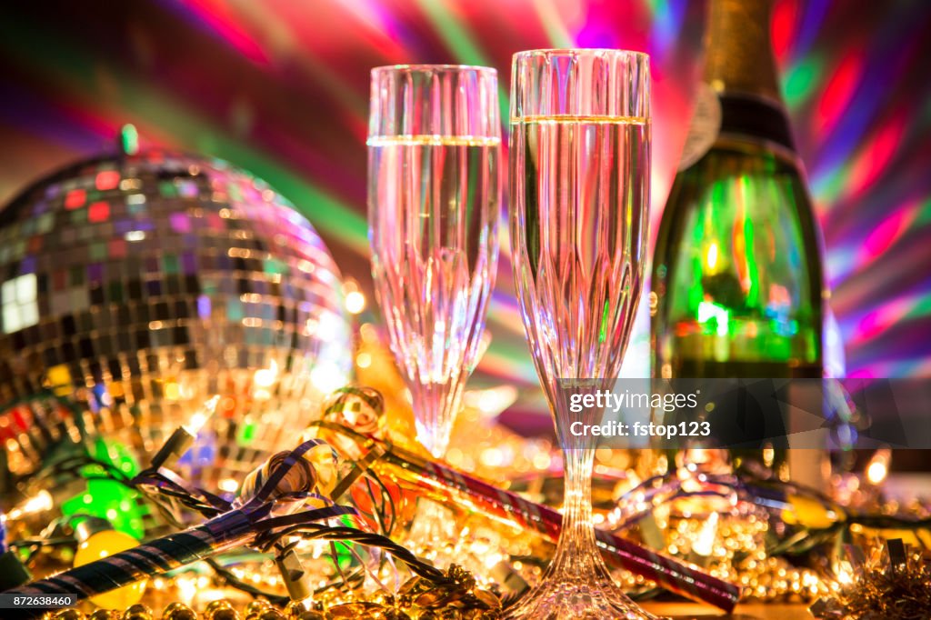 New Year's Eve holiday party with champagne, disco ball, decorations.