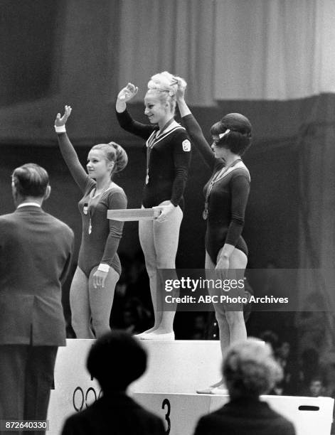 Mexico City, Mexico Zinaida Voronina, Vera Caslavska, Natalia Kuchinskaya medal ceremony, at 1968 Olympics.