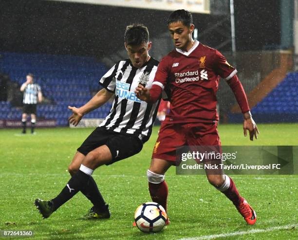 Yan Dhanda of Liverpool and Dam Ward of Newcastle United in action during the Premier League International Cup match between Liverpool U23 and...