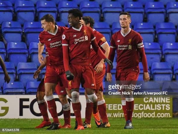 Ovie Ejaria of Liverpool celebrates his goal with team mates Conor Masterson and Corey Whelan during the Premier League International Cup match...