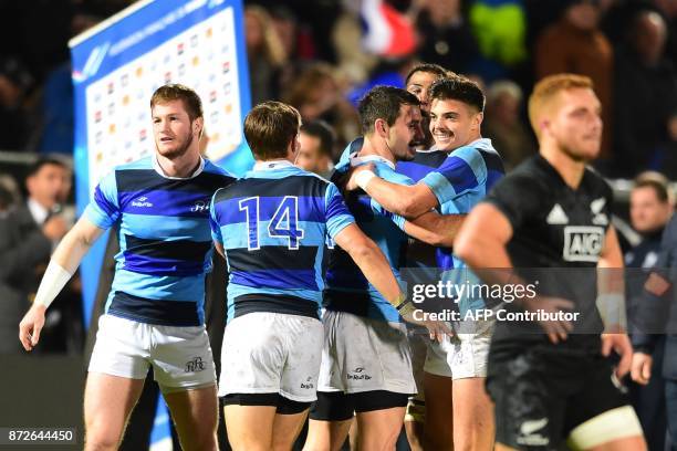 Barbarian's players celebrate at the end of the rugby union match between French Barbarians and New Zealand's Maoris All Blacks on November 10, 2017...