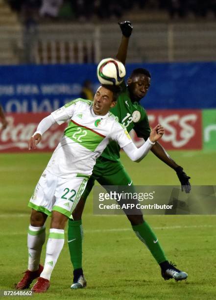 Algerian Ismael Bennacer vies with Nigerian Wilfred Ndadi during a World Cup 2018 qualifying football match between Algeria and Nigeria at...
