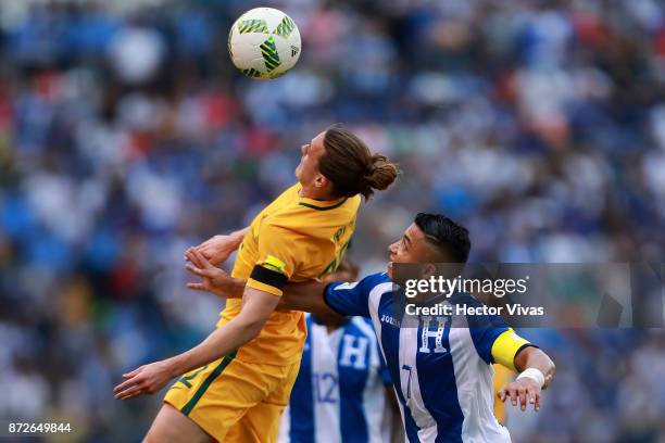 Jackson Irvine of Australia struggles for the ball with Emilio Izaguirre of Honduras during a first leg match between Honduras and Australia as part...