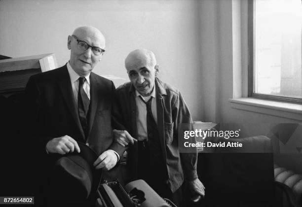 Yiddish writer and journalist for The Jewish Daily Forward Isaac Bashevis Singer poses for a portrait with co-worker and poet Maurice Winograd in the...