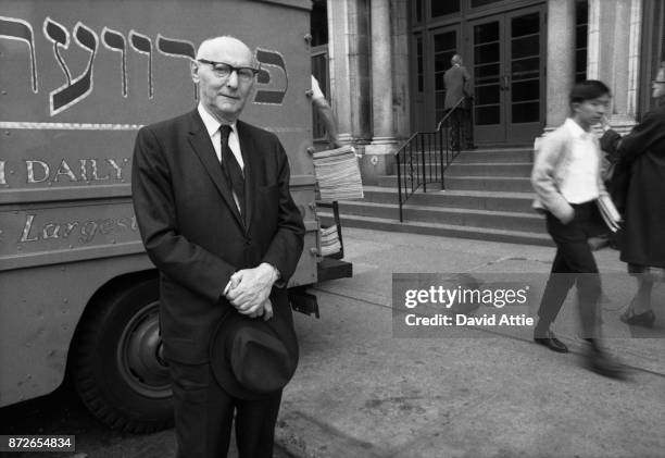 Yiddish writer and journalist for The Jewish Daily Forward Isaac Bashevis Singer poses for a portrait outside the Forward Building in the Lower east...