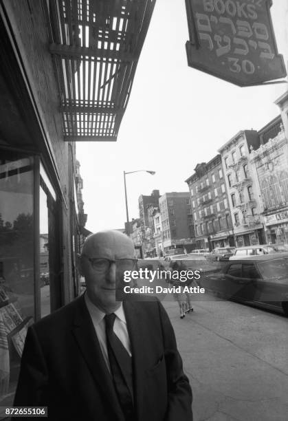 Yiddish writer and journalist for The Jewish Daily Forward Isaac Bashevis Singer poses for a portrait outside the S. Rabinowitz Hebrew Book Store at...