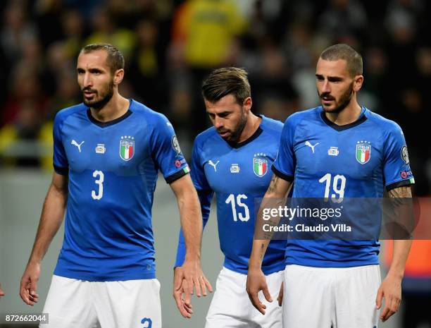 Giorgio Chiellini, Andrea Barzagli and Leonardo Bonucci of Italy look on during the FIFA 2018 World Cup Qualifier Play-Off: First Leg between Sweden...