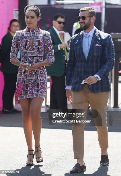 Kris Smith and Sarah Boulazeris pose at the Myer Marquee on Stakes Day at Flemington Racecourse on November 11, 2017 in Melbourne, Australia.