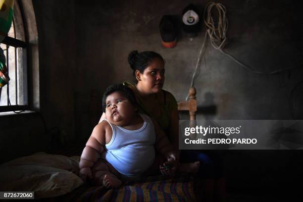Ten-month-old Luis Gonzales and his mother Isabel Pantoja are pictured at their home in Tecoman, Colima state, Mexico on November 8, 2017. Luis...
