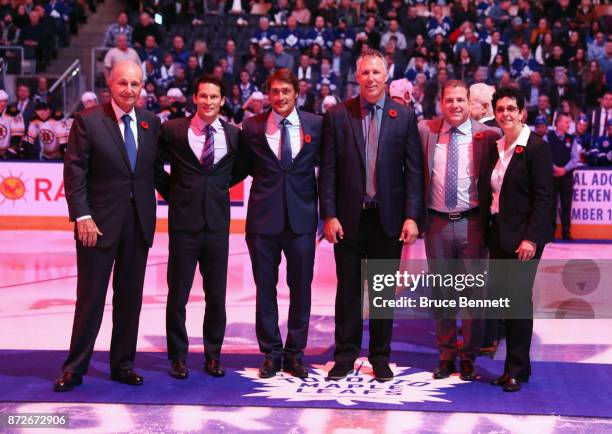 Jeremy Jacobs, Paul Kariya, Teemu Selanne, Dave Andreychuk, Mark Recchi and Danielle Goyotte take part in the pregame ceremony prior to the game...