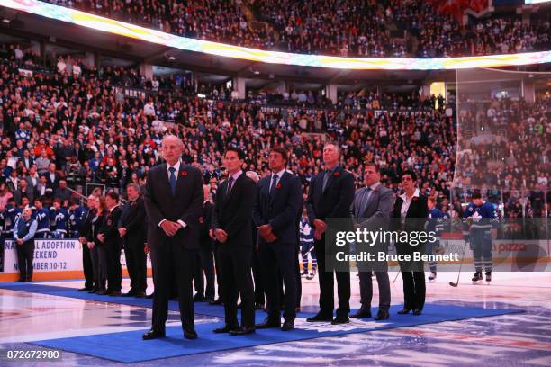 Jeremy Jacobs, Paul Kariya, Teemu Selanne, Dave Andreychuk, Mark Recchi and Danielle Goyotte take part in the pregame ceremony prior to the game...