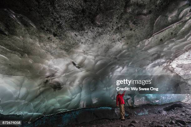 inside the mendenhall ice cave in alaska - wu swee ong stock pictures, royalty-free photos & images