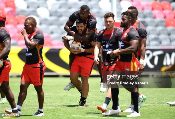 Rhyse Martin and team mates share a laugh during a PNG Kumuls Rugby League World Cup captain's run on November 11, 2017 in Port Moresby, Papua New...