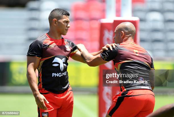 David Mead and Paul Aiton warm-up during a PNG Kumuls Rugby League World Cup captain's run on November 11, 2017 in Port Moresby, Papua New Guinea.