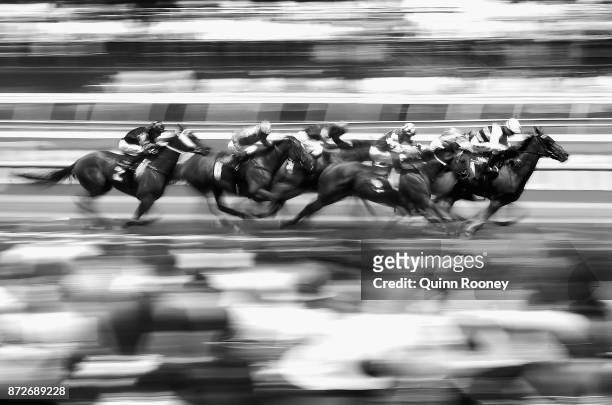 The field head down the straight in race 3, the Melbourne's Own 3AW Trophy during 2017 Stakes Day at Flemington Racecourse on November 11, 2017 in...