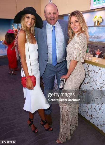 Billy Brownless and daughters Lucy Brownless and Ruby Brownless pose at the Emirates Marquee on Stakes Day at Flemington Racecourse on November 11,...
