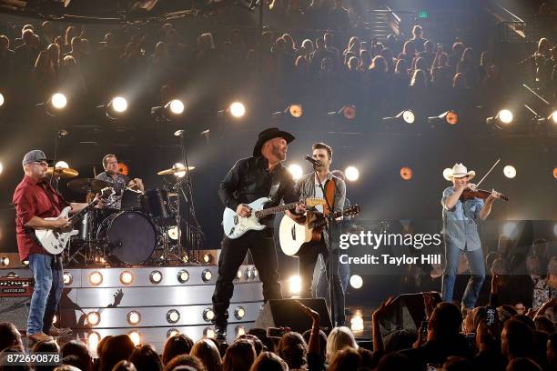 Garth Brooks and Mitch Rossell perform during the 51st annual CMA Awards at the Bridgestone Arena on November 8, 2017 in Nashville, Tennessee.