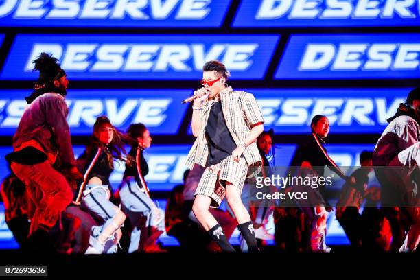Singer Kris Wu performs on the stage during 2017 Alibaba Singles' Day Global Shopping Festival gala at Mercedes-Benz Arena on November 10, 2017 in...