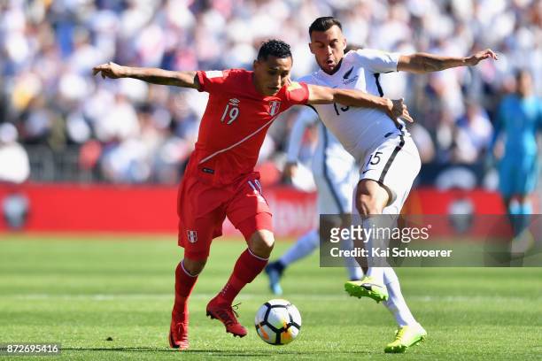 Yoshimar Yotun of Peru controls the ball from Clayton Lewis of the All Whites during the 2018 FIFA World Cup Qualifier match between the New Zealand...