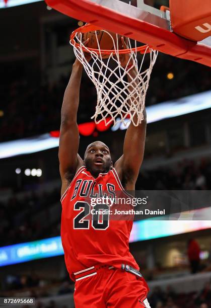 Quincy Pondexter of the Chicago Bulls dunks against the Indiana Pacers at the United Center on November 10, 2017 in Chicago, Illinois. The Pacers...