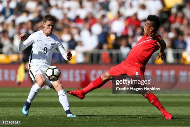 Michael McGlinchey of New Zealand and Christian Cueva of Peru compete for the ball during the 2018 FIFA World Cup Qualifier match between the New...