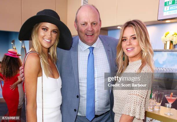 Billy Brownless and daughters Lucy Brownless and Ruby Brownless pose at the Emirates Marquee on Stakes Day at Flemington Racecourse on November 11,...